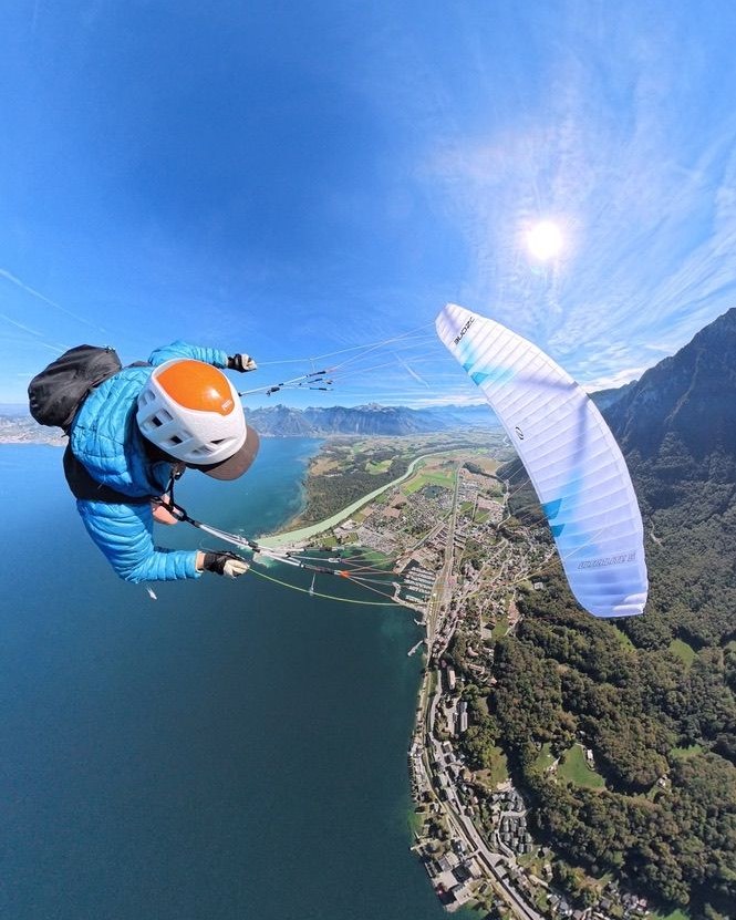 Olly paragliding high above Lake Geneva
